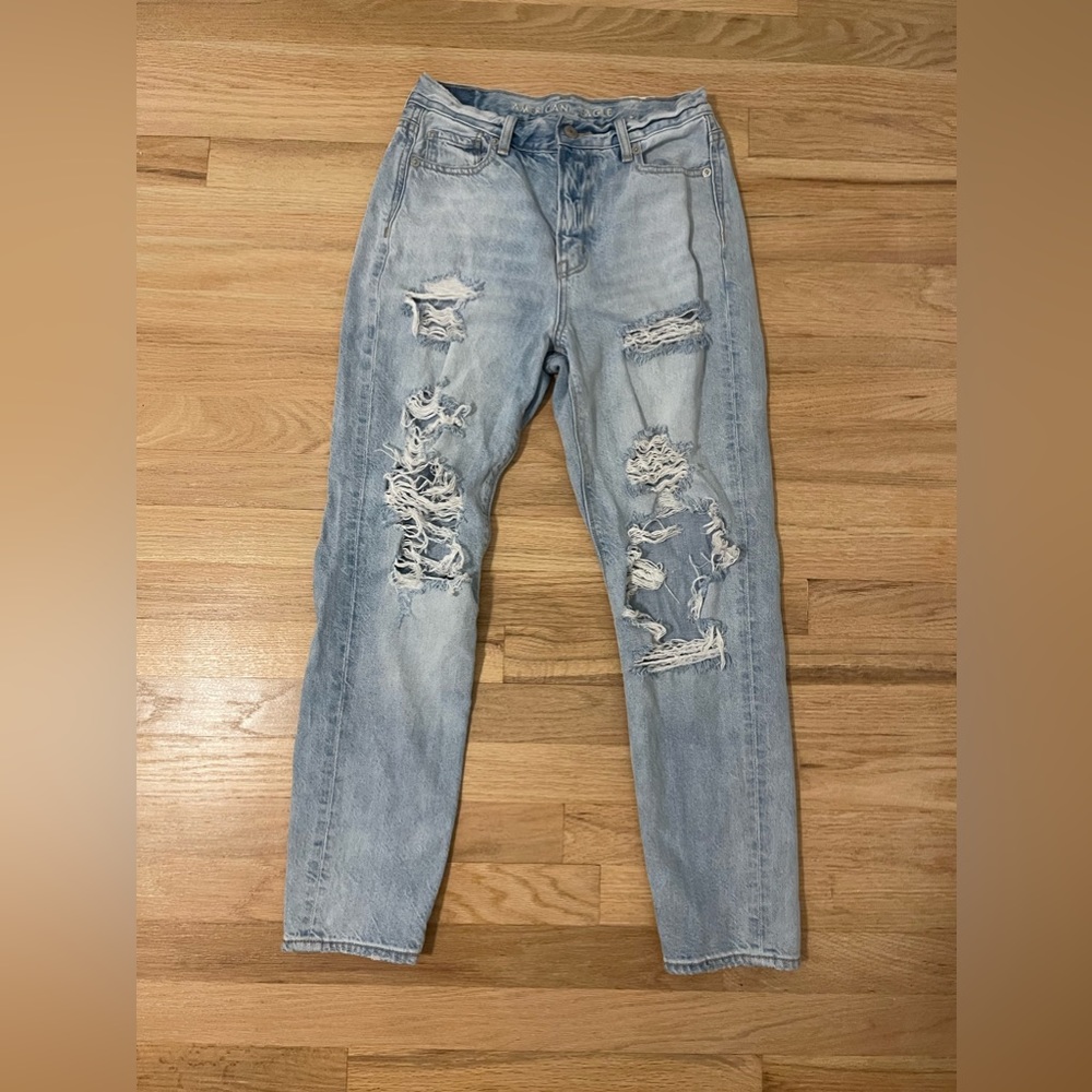 American Eagle mom jeans with rips in light wash; size 0